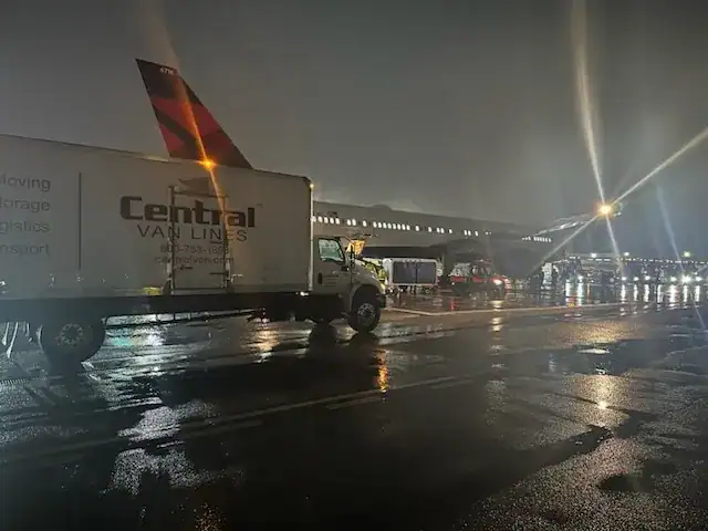Central Van Lines trucks transporting employee household goods