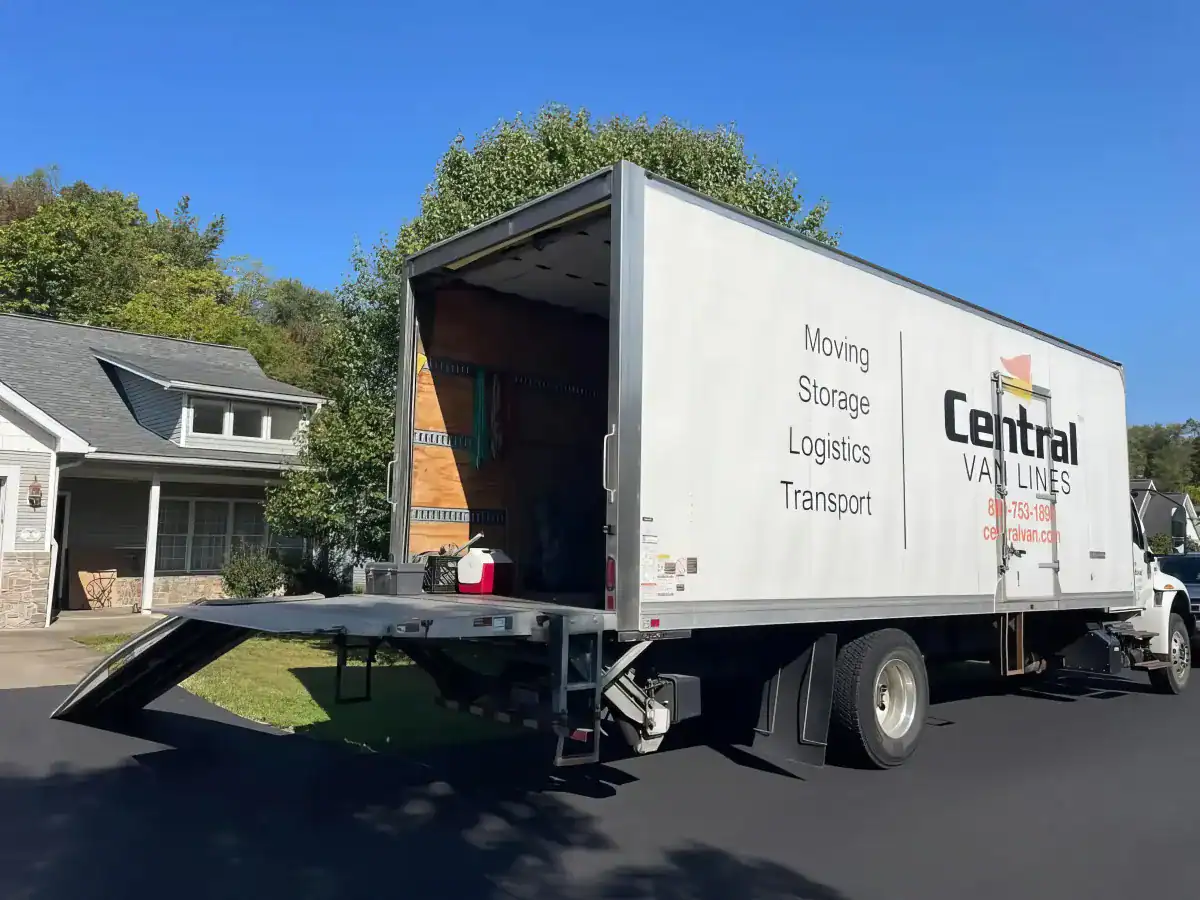 Central Van Lines moving truck parked outside with Moving, Storage, Logistics, and Transport branding on the side