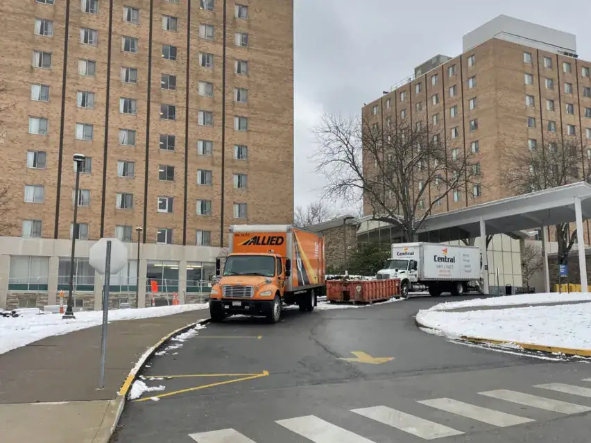 Central Van Lines trucks at a university residence hall