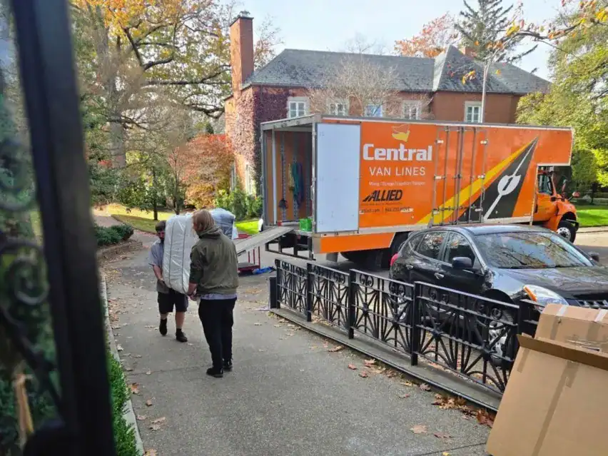 Central Van Lines truck loading at a residential home