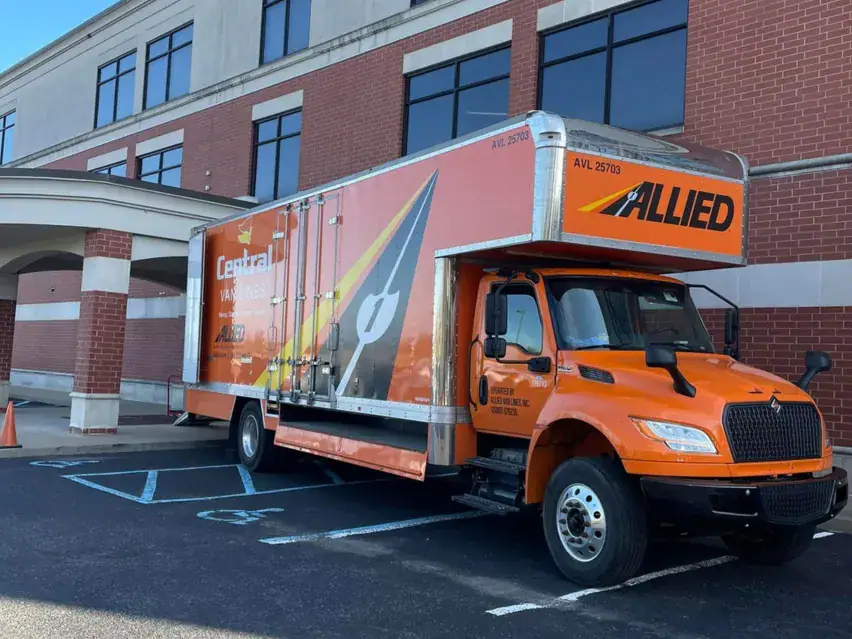 Central Van Lines moving truck parked in front of a commercial building